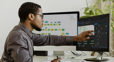 Person looking at intelligence data on a map and chart