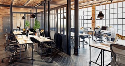 An empty office with brick walls, a cement floor, bookshelves and armchairs with a graphic of a red location icon in the center