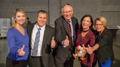Jack Dangermond with four other individuals giving a thumbs up