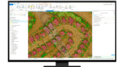A graphic of a computer monitor displaying an aerial photo of a suburban neighborhood