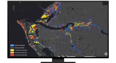 A desktop computer showing a map with highlighted areas that were affected by floods and other watershed