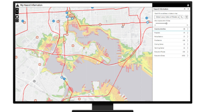 A desktop computer showing a map of hazard information with red lines indicated traffic areas, red dots showing collisions, and other locations marked for important destinations such as hospitals and shelter locations