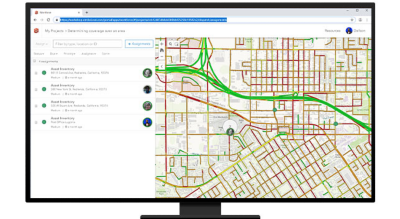 A desktop with a webpage of asset inventory and a map showing easy and congested roadway drive times