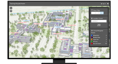 A desktop computer showing a map of a hospital with separated floors and red lines pointing to where the assets are in each building 