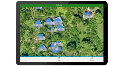 A graphic of a tablet displaying an aerial photo of a wooded area with several buildings, overlaid with labeled data for each building