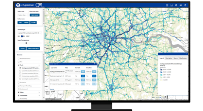 Graphic of a computer monitor displaying a map dashboard with a city map in green and blue