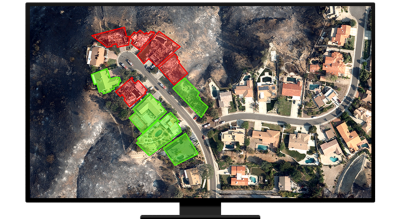 A graphic of a computer monitor displaying an aerial photo of a suburban neighborhood with some homes highlighted in green and red