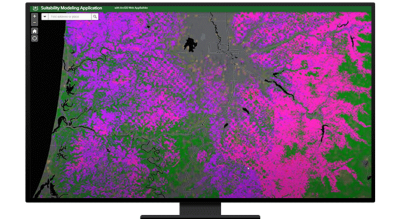 A graphic of a computer monitor displaying a heat map in bright green and hot pink on a black background
