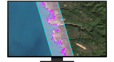 A monitor displaying a coastal map marked in purple