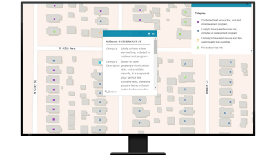 A graphic of a computer monitor displaying a neighborhood map with a point on each home, one of which is projecting a small menu of property data