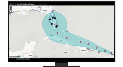 A graphic of a computer monitor displaying the progress of a tornado along a coastline in blue on a gray background